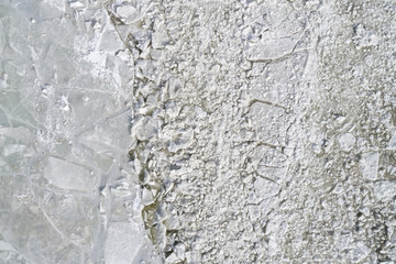 Wall Mural - Cracked Ice from drone view. Winter background texture concept. Aerial view of the frozen surface.