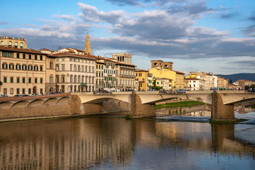 Wall Mural - FLORENCE, TUSCANY/ITALY - OCTOBER 18 : View of buildings along and across the River Arno in Florence  on October 18, 2019. Unidentified people.