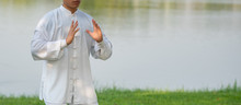 Asian Healthy Man With Tai Chi Pose.
