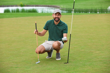 Man playing golf on green course. Sport and leisure