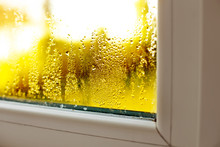 Window Drip Due To Bad Ventilation Inside House. Condensation On Glass During Cold Weather. High Humidity Is Cause Of Mold (mildew, Mould) On House Or Building Surfaces. Water Drop Tracks On Windows.