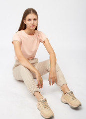 girl in beige cargo pants and a t-shirt