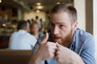 © ruslanshug - people in cafe bearded caucasian man during emotional discussion talk with gesticulation hard trouble