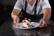 © Alla - The chef is preparing a dessert. I am preparing work in a restaurant of cuisine. Cooking concept. Out of focus. Photo without a face.