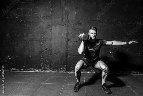 Fotomural Young strong fit muscular sweaty man with big muscles strength cross workout tra