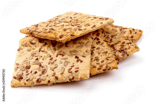 Fotografía Crispy crackers with sesame and flax seeds, isolated on white background