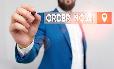 Text sign showing Order Now. Business photo showcasing confirmed request by one party to another to buy sell Businessman pointing with pen in empty copy space