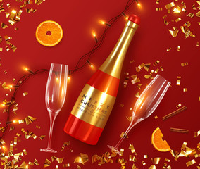 Festive Christmas background. Xmas design with realistic red bottle of champagne and wine, two glasses, sparkling lights garland, orange and cinnamon, glitter gold confetti. Flat lay, top view.