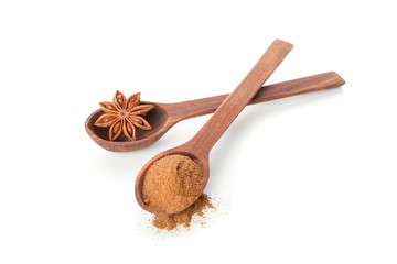 Poster - Wooden spoons with cinnamon powder and anise isolated on white background