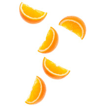 Falling Fresh Orange Fruit Slices Isolated Over White Background Closeup. Flying Food Concept. Top View. Flat Lay. Orange Slice In Air, Without Shadow..