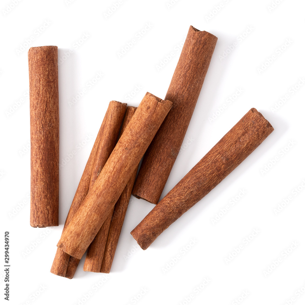 Cinnamon sticks isolated on white background closeup. Canella spice. Aromatic condiment background. Flat lay, top view. - obrazy, fototapety, plakaty 