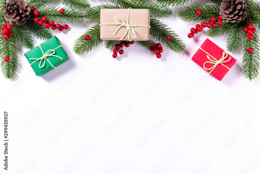 Christmas composition. Gifts, fir tree branches, red berries on white background. Christmas, winter, new year concept. - obrazy, fototapety, plakaty 
