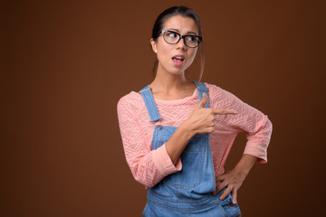 Wall Mural - Portrait of beautiful multi ethnic nerd woman with eyeglasses