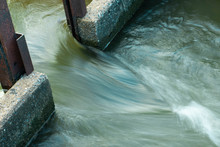 The Water Flows Through The Floodgates In The Irrigation Canals.