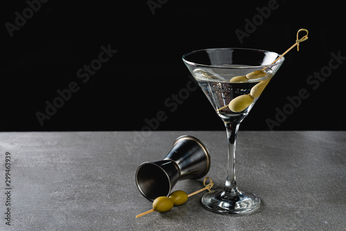 Cuadros en Lienzo Drink Dry Martini with Green Olives on Stone Background.