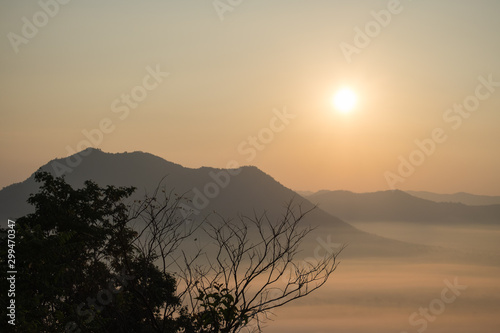 Natural scenery in the morning, the sun is rising and fog