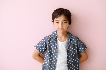 Wall Mural - Cute little boy on color background