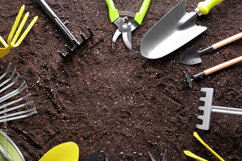 Set of gardening equipment on soil