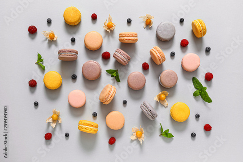 Photographie Assortment of tasty macarons on grey background