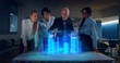 © Kitreel - A group of modern designers are using a futuristic sophisticated technology screen with augmented reality holograms for a new project realization in an office.
