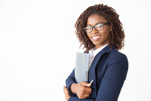 Happy Confident Legal Expert In Glasses Holding Documents, Looking At Camera, Smiling. Young African American Business Woman Posing Isolated Over White Background. Female Professional Portrait Concept