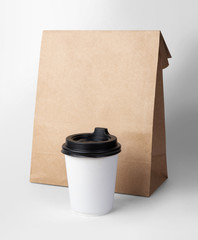 Wall Mural - Paper bag and coffee cup isolated on white background with clipping path