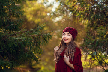 portrait of a young beautiful blonde in a hat on a background of the city of Moscow