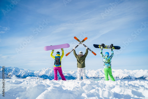 Fotomural Photo from back of three snowboarders with their hands on snow resort