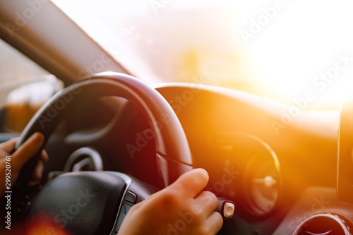 Cuadros en Lienzo Close up of driver hands driving in road trip