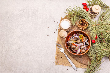 Wall Mural - Pickled (fermented) mushrooms. Traditional New Year (Christmas) snack. Festive table cutlery setting