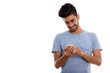 © Ranta Images - Studio shot of young happy Persian man smiling while using phone
