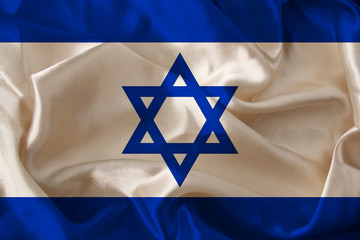 photo of the beautiful colored national flag of the modern state of Israel on textured fabric, concept of tourism, economics and politics, closeupof travel, economy and state policy