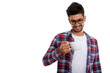 © Ranta Images - Young bearded Persian hipster man holding coffee cup