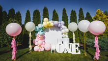Photo Zone In Pink White Style With Paper Stars, Balloons, Large, Voluminous Paper Figure Word One. Birthday Decor. Holiday Decoration.Balloons. Children Party Background