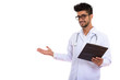 © Ranta Images - Portrait of young handsome bearded Persian man doctor holding clipboard