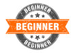 beginner round stamp with orange ribbon. beginner