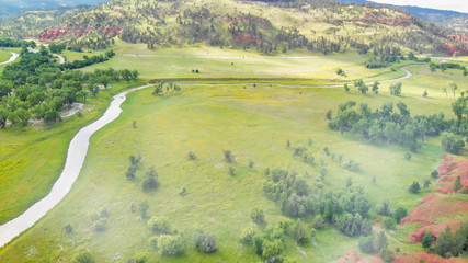 Wall Mural - Beautiful overhead aerial view of countryside meadows in summer season