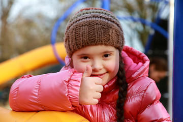 Wall Mural - Portrait of beautiful girl on the playground