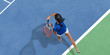 © master1305 - Young caucasian brunette woman in blue shirt playing tennis at the court. Hits ball with racket, outdoors. Youth, flexibility, power, energy. Copyspace. Top view. Motion, action, healthy lifestyle.