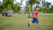 © Songkhla Studio - Cute Asian Kid making soap bubbles outside, summer time.