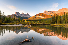 Scenery Of Three Sisters Mountain Reflection On Pond At Sunrise In Autumn At Banff National Park