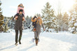© Studio Romantic - Happy family sledding in the park in winter.