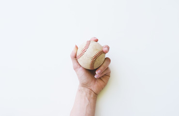 Canvas Print - Hand holding old used baseball, isolated on white background.