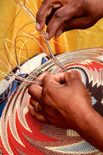 African Women Demonstrating Basket Weaving.