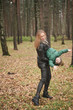 © goldeneden - beautiful Caucasian mother and little child having fun in autumn Park, walking.
