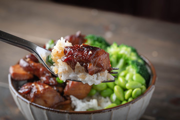 teriyaki chicken rice bowl with broccoli and edamame