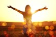 © BillionPhotos.com - Young woman on field under sunset light