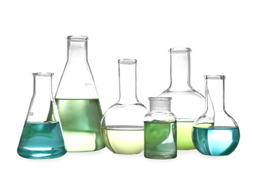 Glassware with liquids isolated on white. Laboratory analysis