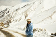 © tuayai - Travelers thai woman travel visit stand for take photo at Khardung La Road on top of himalaya mountain between go to Nubra valley village at Leh Ladakh while winter season in Jammu and Kashmir, India