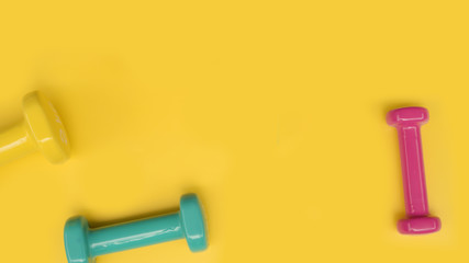 Wall Mural - close up of dumbbell on yellow background